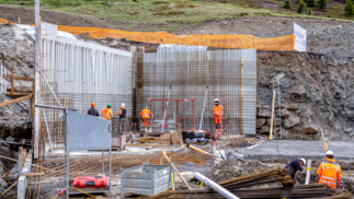 Zoom in on the basement walls under construction.